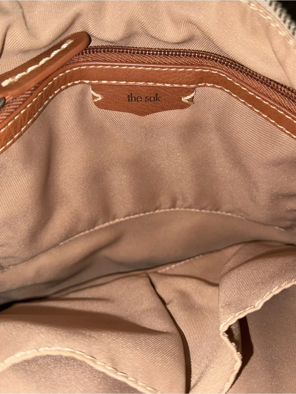 The Sak Soft Pebbled Cream Leather Crossbody with Charm Tassel